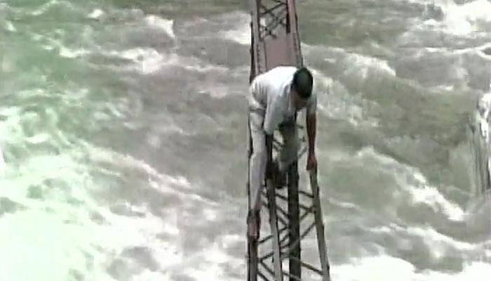 This video will send shivers down your spine! Watch how people cross a raging river in Uttarakhand