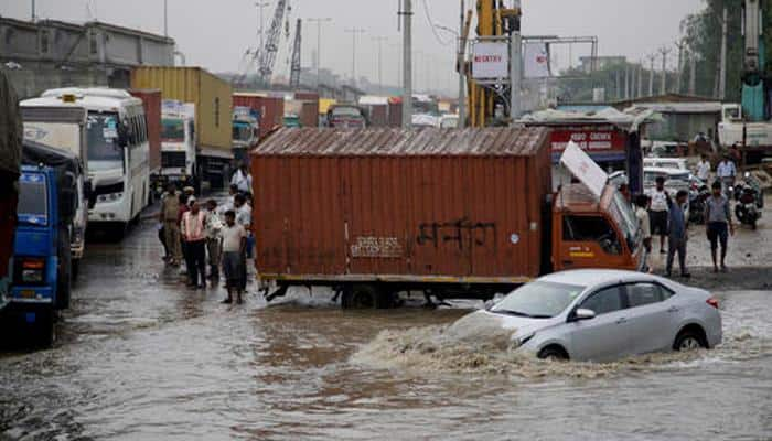 Major cities choked due to heavy rains,  people catch fish on streets in Bengaluru