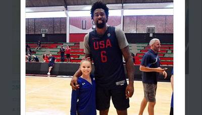 WHOA! US Gymnast poses with 2-and-a-half feet taller American basketball player – SEE PIC