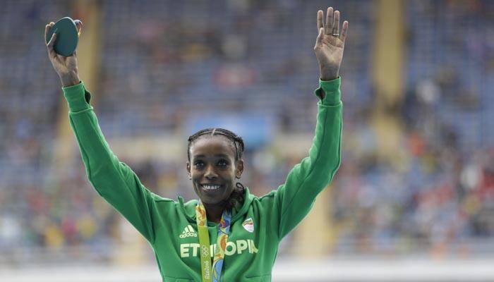 Ethiopia's Almaz Ayana shatters world record to win 10,000 meter race
