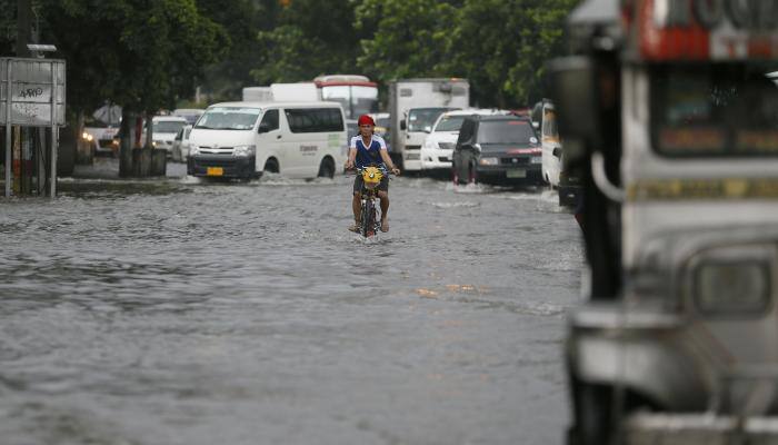 Five dead, tens of thousands flee Philippines floods