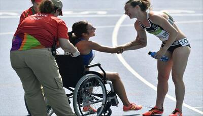 PHOTOS: Olympic Spirit! American runner Abbey D'Agostino stops to help fallen athlete during 5,000 metre run 