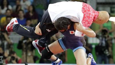 WATCH: Japan's Risako Kawai celebrates gold medal win by slamming coach to the mat