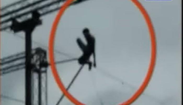 SHOCKING: Man performing stunt on high tension wire at Mumbai's Mira road station – Watch