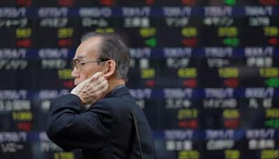 Most Asian markets slump, Tokyo soars on US rate talk