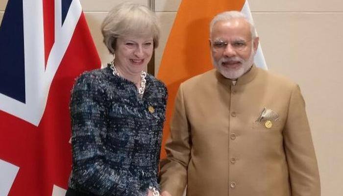 PM Modi raises Scorpene data leak with Hollande; tells May &#039;UK visa policy could have negative impact on Indians&#039;