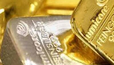 Gold hits over two-week high as US data trims rate hike hopes