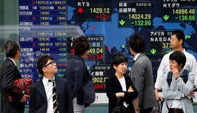 Asian markets slip but China lifts Hong Kong, Shanghai