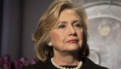 Clinton falls ill at 9/11 memorial, later says 'feeling great'