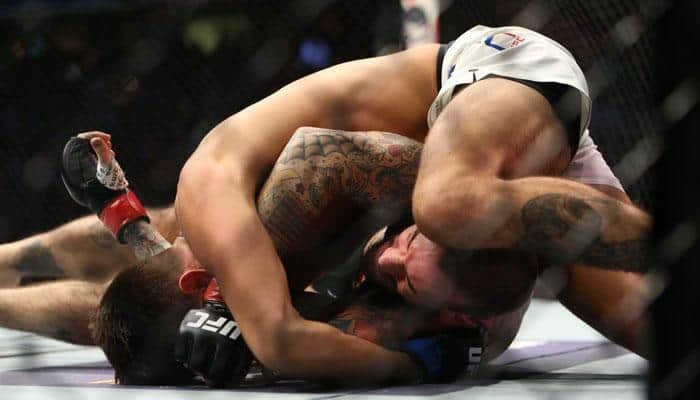 WATCH! WWE superstar CM Punk absolutely destroyed on his UFC debut by Mickey Gall