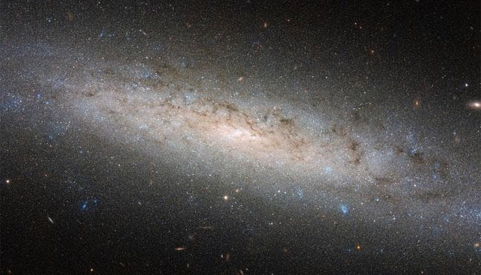 NASA&#039;s Hubble explores the hidden dark side of NGC 24