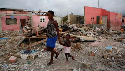 Hurricane Matthew toll in Haiti at 1,000, buries dead in mass graves