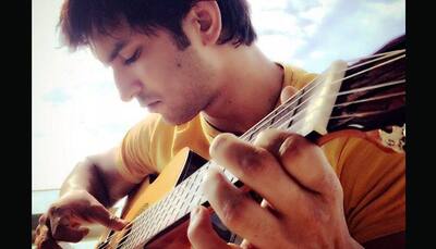 Sushant Singh Rajput romances guitar- WATCH
