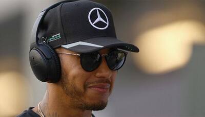 United States GP: Lewis Hamilton outpaces Mercedes team-mate Nico Rosberg to pole