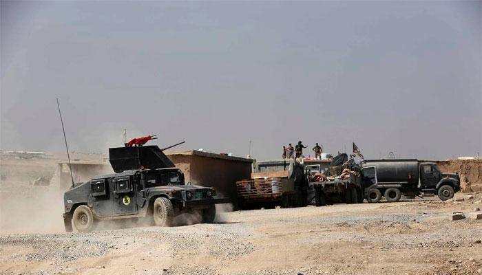 Iraqi forces advance near Mosul as IS attacks western town