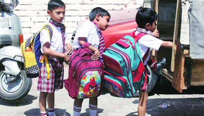 School children carrying heavy bags to school are affecting their health adversely: DoE