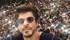 At 51, Shah Rukh Khan continues to charm 'jabra' fans with dimpled smile, flying kisses