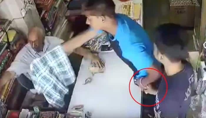 Viral Video: Gang of thieves looting elderly shopkeeper just under his nose - CAUGHT on CCTV!