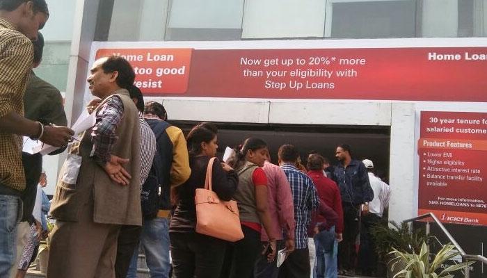 Long queues, chaos continue at ATMs even as banks pump in cash Long queues, chaos continue at ATMs even as banks pump in cash