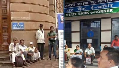 Tempers flare outside ATMs second day as cash crunch continues to frustrate serpentine queues