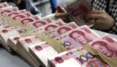 China weakens yuan to eight-year low against US dollar