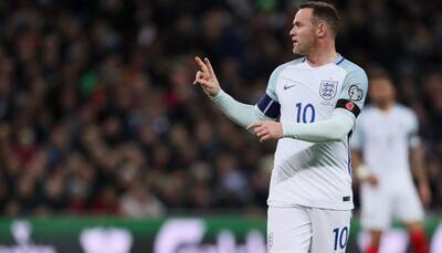England captain Wayne Rooney apologises for inappropriate drunk photos