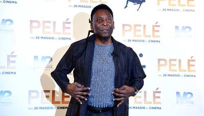 Football legend Pele using a walker-his new 'soccer shoes with wheels'