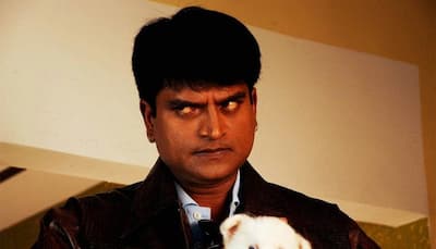South filmmaker Ravi Babu stands in ATM queue with little piglet in his arms!