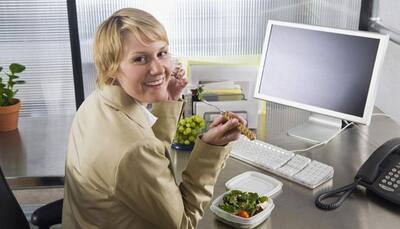 Consuming food at office desk hamper's employees productivity