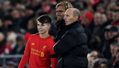 League Cup: Ben Woodburn makes history as Liverpool advance into semi-final