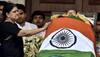 Sasikala Natarajan stands beside Amma's casket, just like Jayalalithaa stood by MGR's body