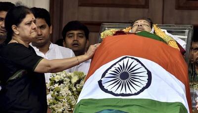 Sasikala Natarajan stands beside Amma's casket, just like Jayalalithaa stood by MGR's body