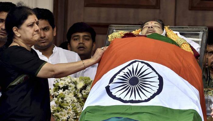 Sasikala Natarajan stands beside Amma's casket, just like Jayalalithaa stood by MGR's body