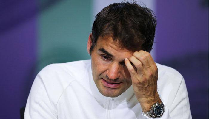Roger Federer congratulates Britian's Andy Murray for becoming world number one, surpassing Novak Djokovic