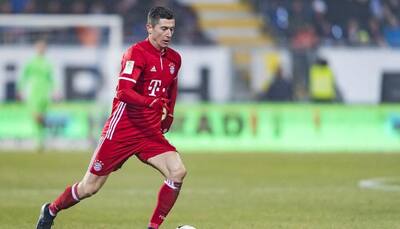 Bundesliga: Robert Lewandowski scores as Bayern Munich hammer 10-man Leipzig 3-0