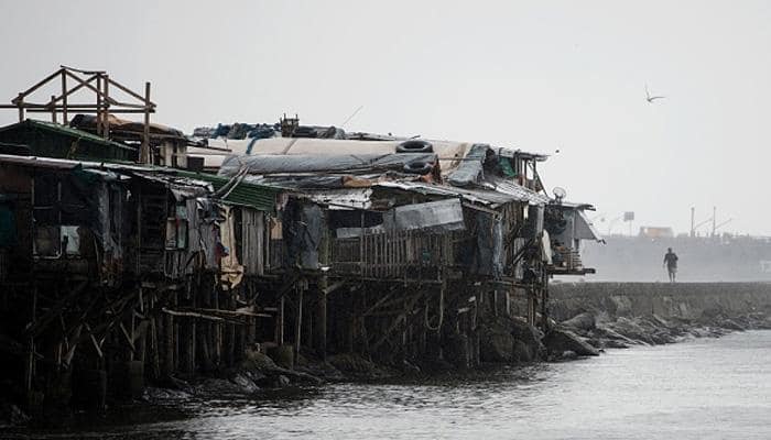 Typhoon eases but Philippines braces for floods, mudslides; 2 dead