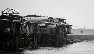 Typhoon eases but Philippines braces for floods, mudslides; 2 dead