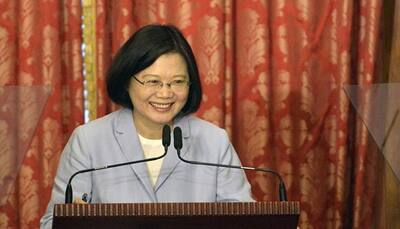 Taiwan won't cave to Beijing threats, says president
