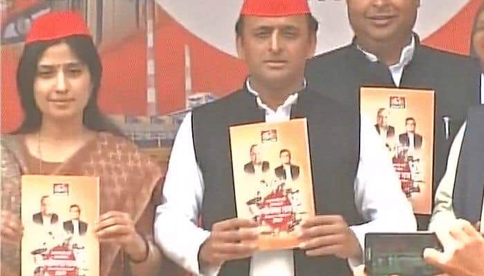 UP Assembly Elections: Akhilesh Yadav with wife Dimple releases Samajwadi Party&#039;s manifesto; Mulayam Singh skips event