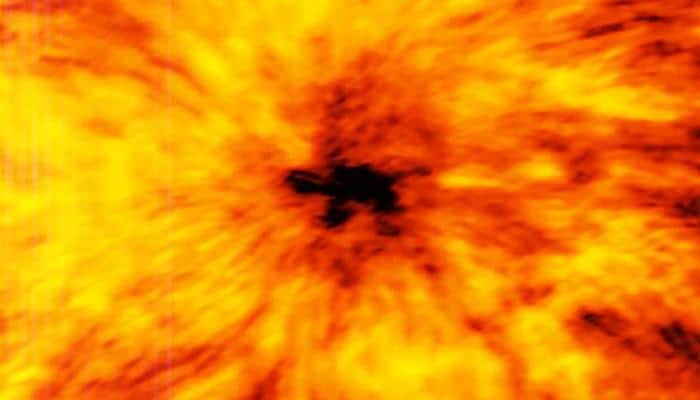 Spotted - Dark, contorted sunspot nearly twice the diameter of Earth (See pic)