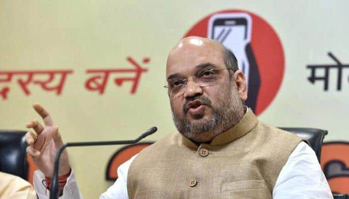 Amit Shah unfurls national flag at BJP headquarters in Delhi