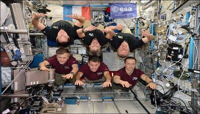 Astronauts or superheroes? ISS crew takes the traditional team photograph to a new level!