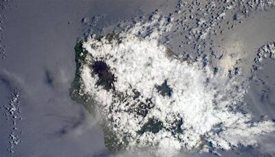 Amazing view of La Réunion with volcano visible between the clouds from ISS! 