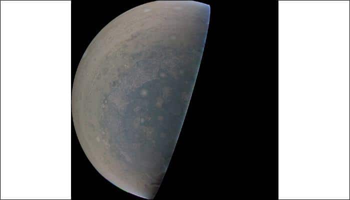 NASA's Juno spots cyclones swirl, white oval storms near Jupiter's limb