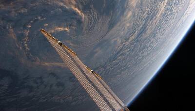 Storm at dusk looks like space station's solar arrays, stirring the clouds! ISS astronaut shares the pic