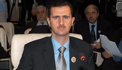 Syrian opposition says ready for Geneva peace talks but Assad must go