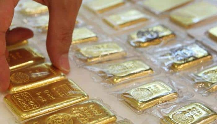 Gold plunges Rs 180 on global cues, easing demand
