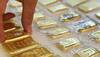 Gold plunges Rs 180 on global cues, easing demand