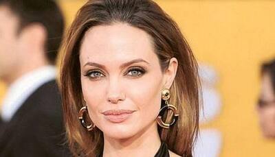Angelina Jolie cooks, eats tarantulas on live TV with children