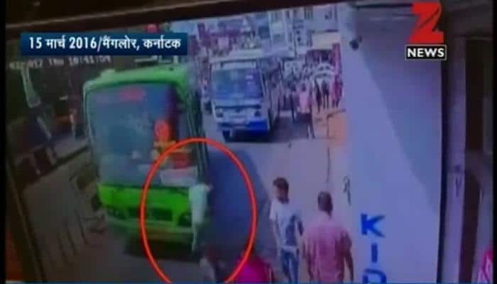 DISTURBING VIDEO: Speeding bus crashes into man busy seeing mobile screen; you won&#039;t believe what happened next - WATCH